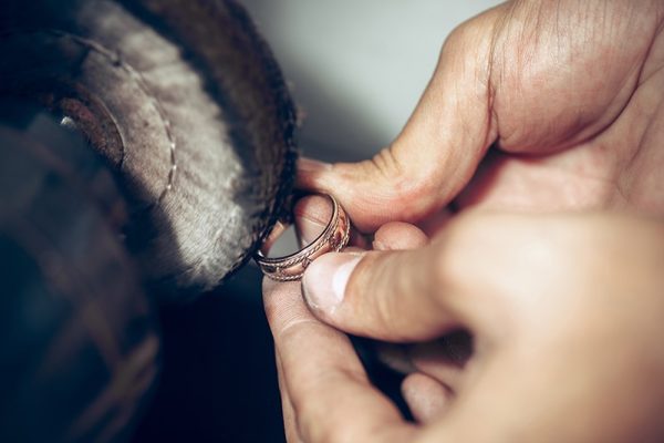 Different goldsmiths tools on the jewelry workplace. Jeweler at work in jewelry. Different goldsmiths tools on the jewelry workplace. Jeweler at work in jewelry. Desktop for craft jewelry making with professional tools. Close up view of tools.